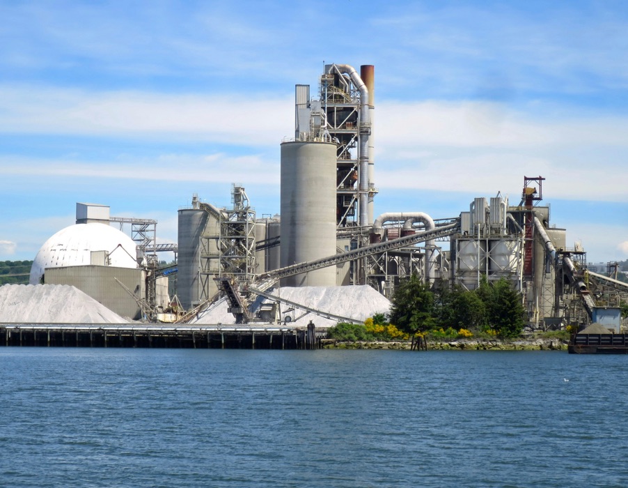 An industrial plant on a waterfront.